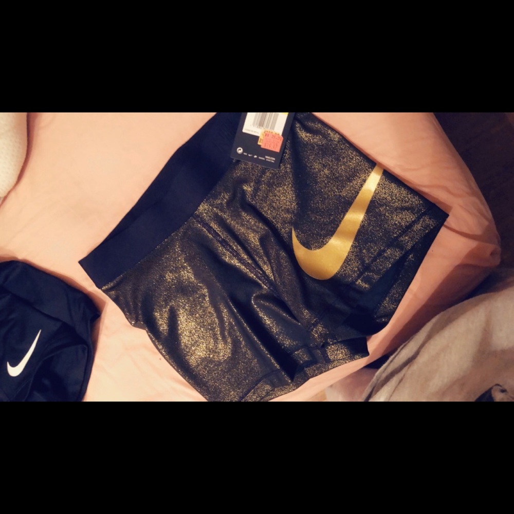 Gold and black nike spandex shorts
